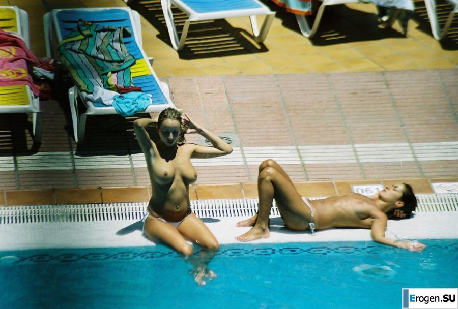 Girls sunbathe topless near the pool. Photo 10