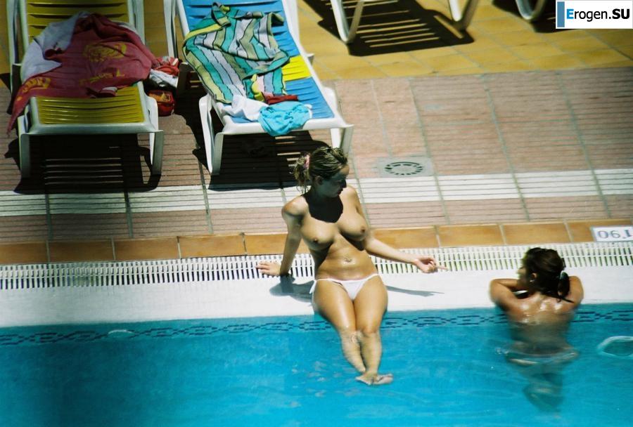 Girls sunbathe topless near the pool. Photo 14