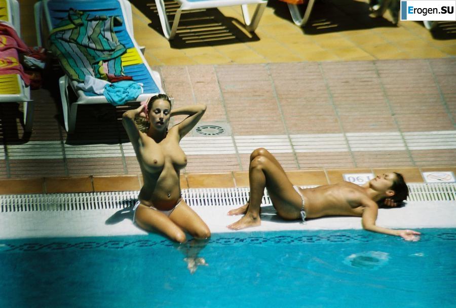 Girls sunbathe topless near the pool. Photo 3