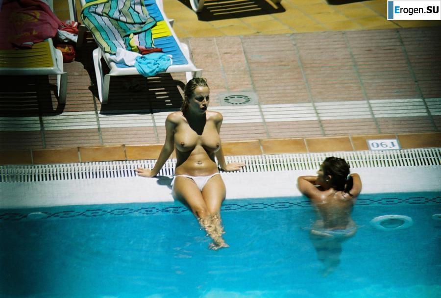 Girls sunbathe topless near the pool. Photo 7