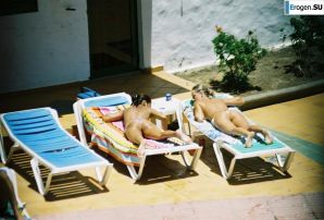 Girls sunbathe topless near the pool. Thumb 16
