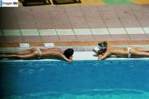 Girls sunbathe topless near the pool. Thumb 27
