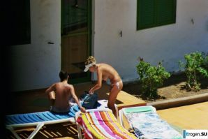 Girls sunbathe topless near the pool. Thumb 31