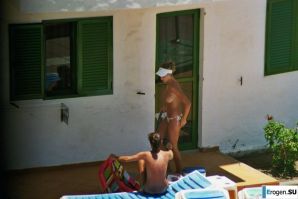 Girls sunbathe topless near the pool. Thumb 32