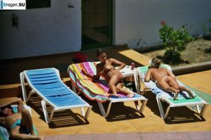 Girls sunbathe topless near the pool. Thumb 38
