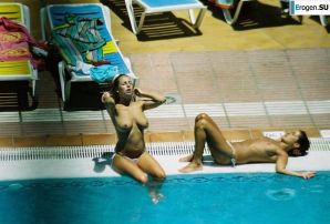 Girls sunbathe topless near the pool. Thumb 5