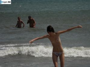Topless thin girl on the beach. Thumb 40