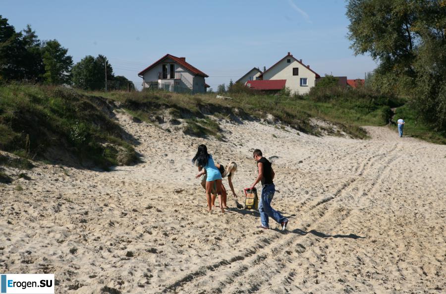 Three nudists on the river bank. Photo 1