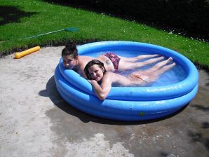 three girlfriends sunbathe in the yard with bare breasts. Thumb 13