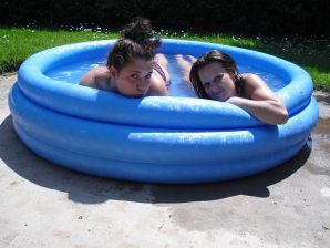 three girlfriends sunbathe in the yard with bare breasts. Thumb 14