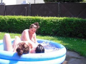 three girlfriends sunbathe in the yard with bare breasts. Thumb 18