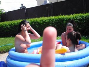 three girlfriends sunbathe in the yard with bare breasts. Thumb 22
