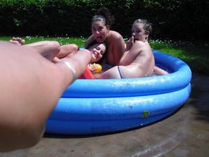 three girlfriends sunbathe in the yard with bare breasts. Thumb 24