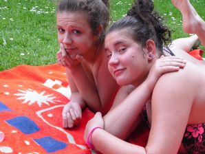 three girlfriends sunbathe in the yard with bare breasts. Thumb 28