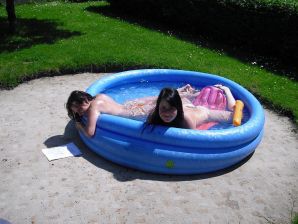 three girlfriends sunbathe in the yard with bare breasts. Thumb 3