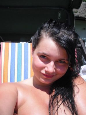 three girlfriends sunbathe in the yard with bare breasts. Thumb 7