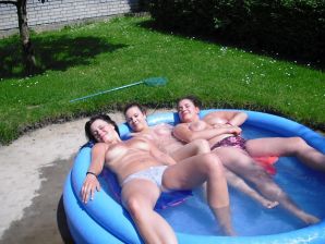 three girlfriends sunbathe in the yard with bare breasts. Part 2. Thumb 16