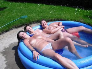 three girlfriends sunbathe in the yard with bare breasts. Part 2. Thumb 17