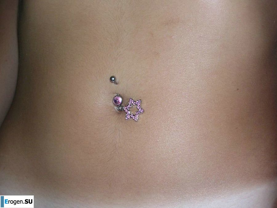 A tanned brunette shines her tits in the morning in bed. Photo 24