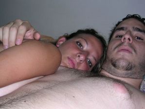 A tanned brunette shines her tits in the morning in bed. Thumb 29