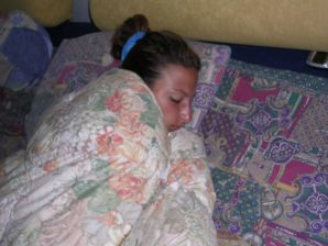 A tanned brunette shines her tits in the morning in bed. Thumb 8