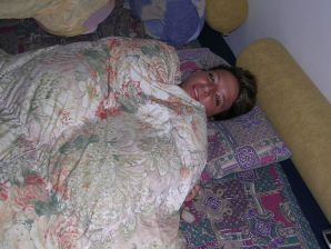 A tanned brunette shines her tits in the morning in bed. Thumb 9