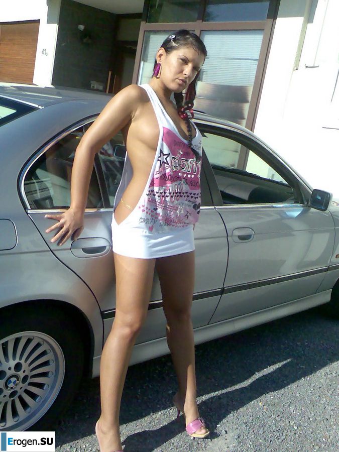 Tanned Latina with big tits shamelessly spread her legs. Photo 8