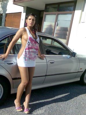 Tanned Latina with big tits shamelessly spread her legs. Thumb 7