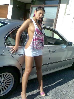 Tanned Latina with big tits shamelessly spread her legs. Thumb 8