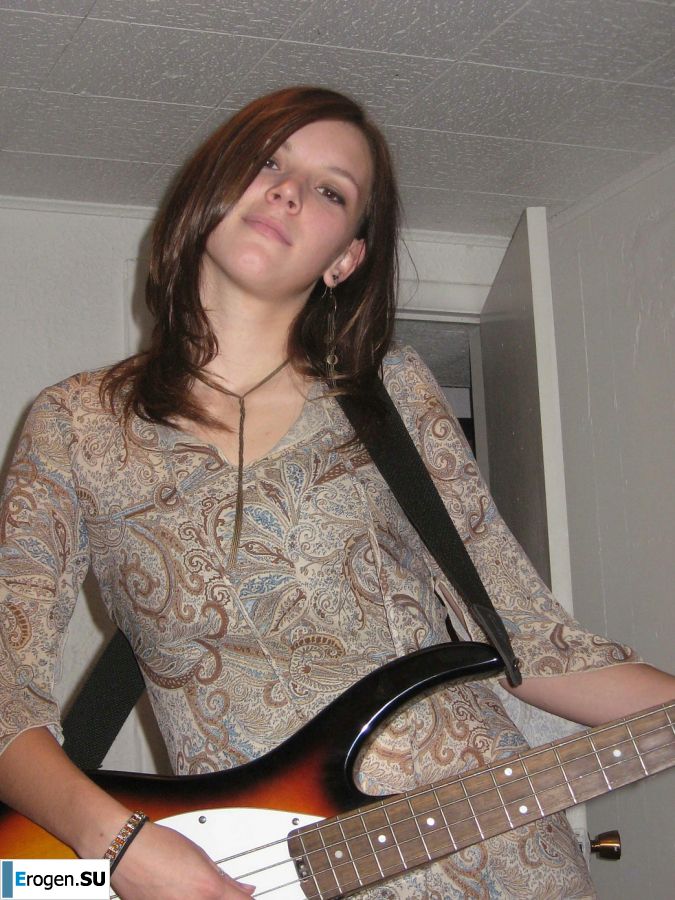 A naked chick poses with a guitar, and a guy licks her. Photo 6