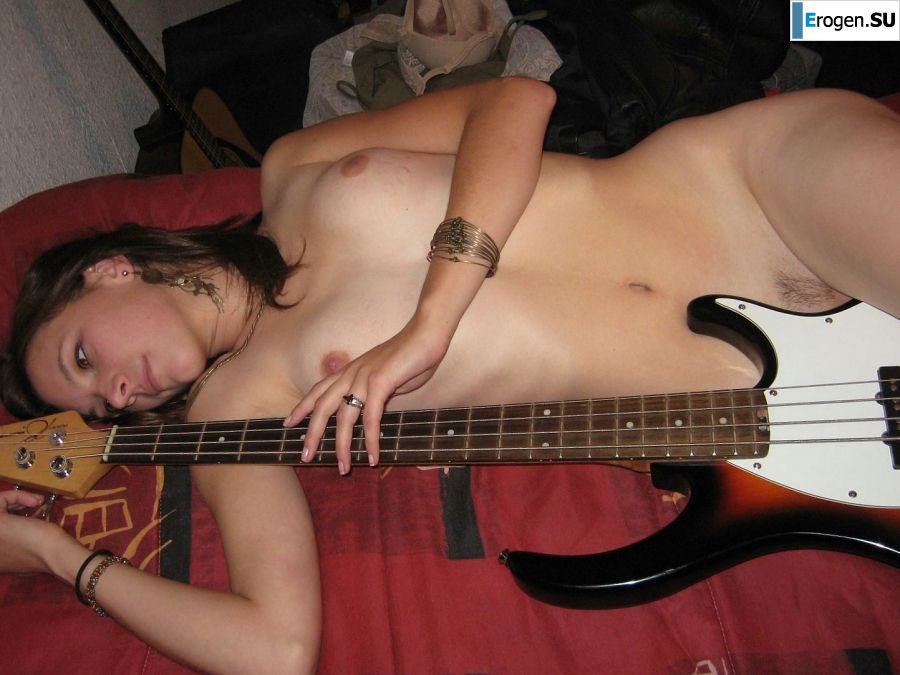 A naked chick poses with a guitar, and a guy licks her. Photo 8