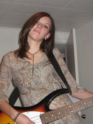 A naked chick poses with a guitar, and a guy licks her. Thumb 6