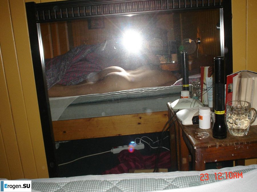 A blue-eyed minx with a pierced nipple plays with her panties. Photo 10