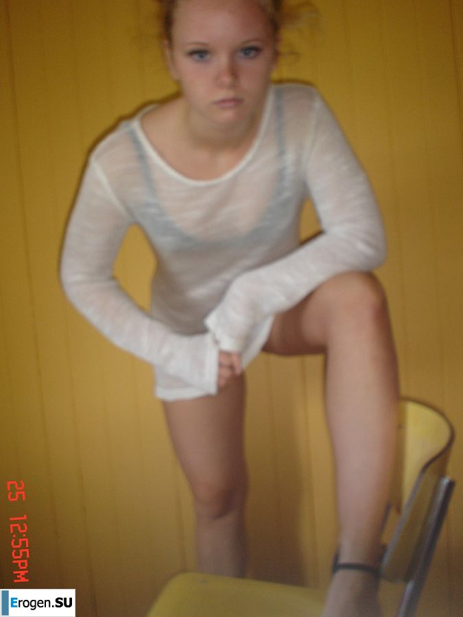 A blue-eyed minx with a pierced nipple plays with her panties. Photo 24