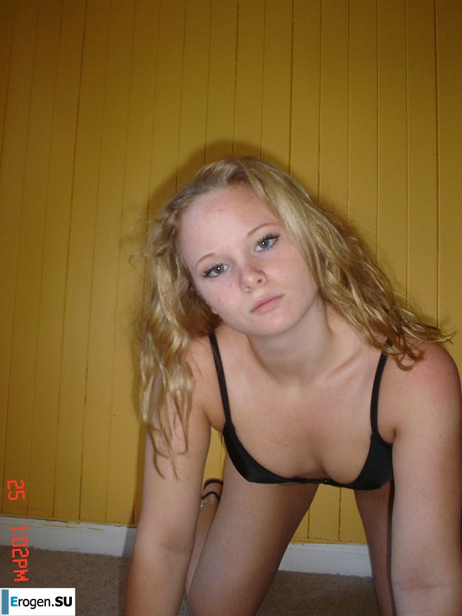 A blue-eyed minx with a pierced nipple plays with her panties. Photo 28