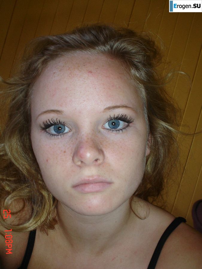 A blue-eyed minx with a pierced nipple plays with her panties. Photo 31