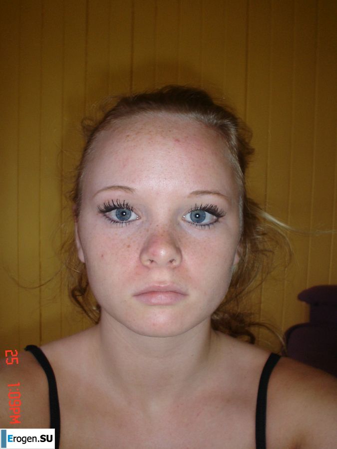 A blue-eyed minx with a pierced nipple plays with her panties. Photo 32