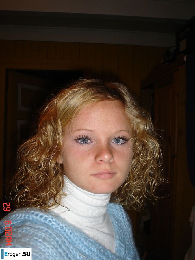 A blue-eyed minx with a pierced nipple plays with her panties. Photo 40