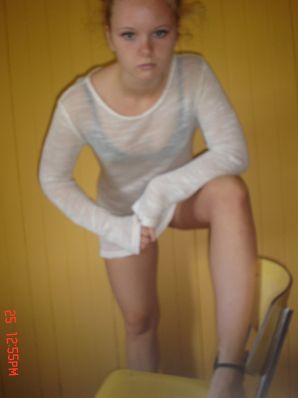 A blue-eyed minx with a pierced nipple plays with her panties. Thumb 24