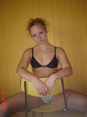 A blue-eyed minx with a pierced nipple plays with her panties. Thumb 25