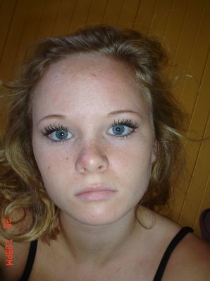 A blue-eyed minx with a pierced nipple plays with her panties. Thumb 31