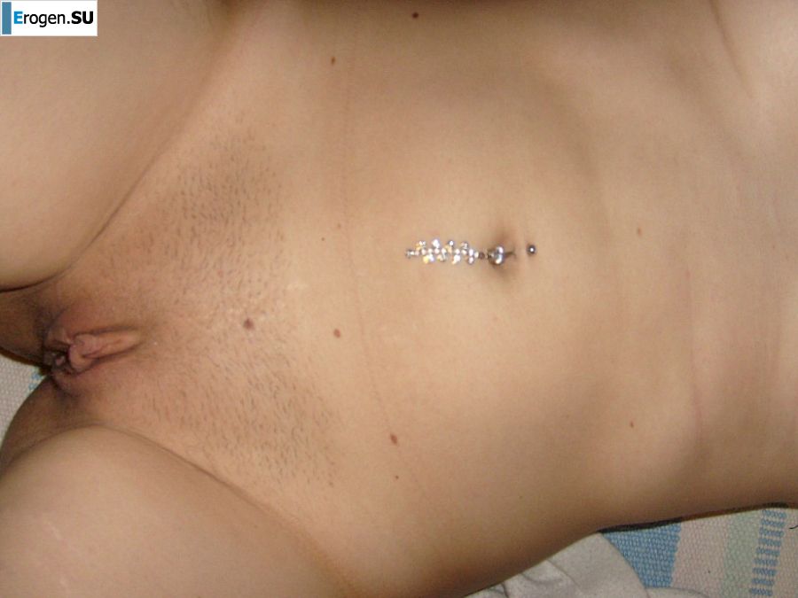 The blonde opened her labia and showed a wet vagina. Photo 17