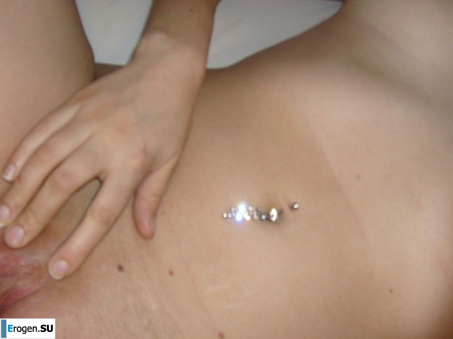 The blonde opened her labia and showed a wet vagina. Photo 29