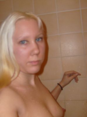 The blonde opened her labia and showed a wet vagina. Thumb 5