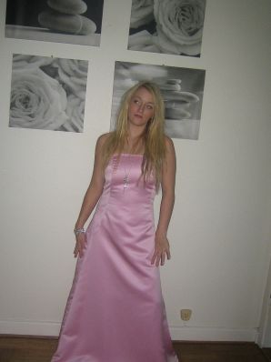 A blonde with silicone breast poses in a short skirt. Thumb 16