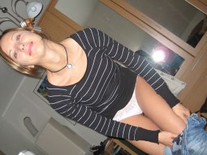 A slender beauty undresses and twists a booty in front of her man. Thumb 11