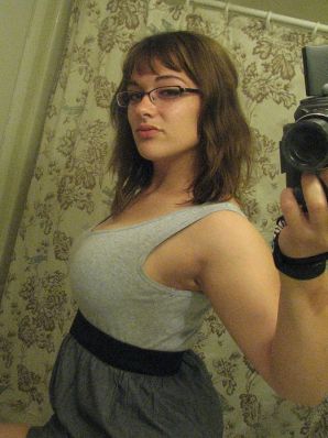 A girl with large breasts poses in clothes and then undresses. Part 2. Thumb 15