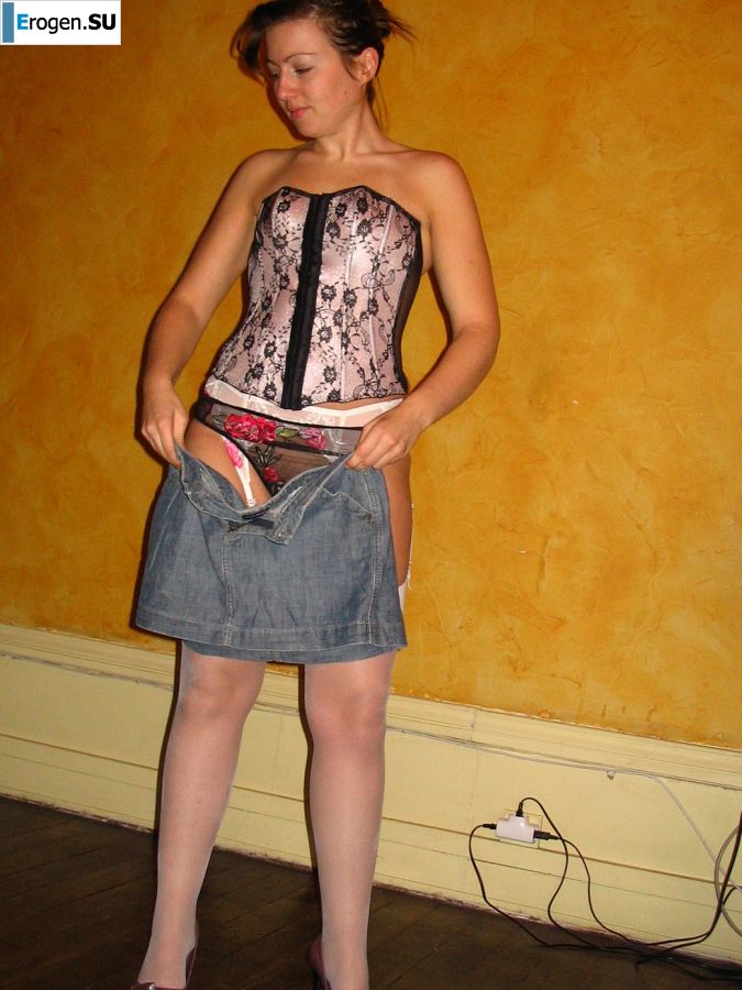 A young woman shows her ass and legs in white stockings. Photo 25