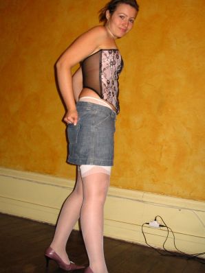 A young woman shows her ass and legs in white stockings. Thumb 23