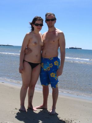 A young woman shows her ass and legs in white stockings. Thumb 6